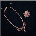 J02. Birks 14K gold and garnet necklace and brooch set. 